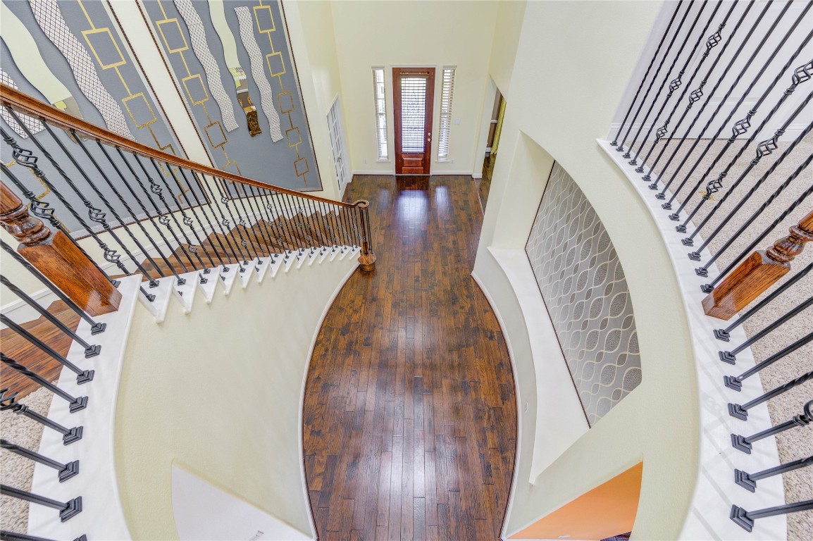 3806 Sims Pointe Court Fulshear, TX 77441 - Photo 44 of 50 a view of stairs and hall with wooden floor