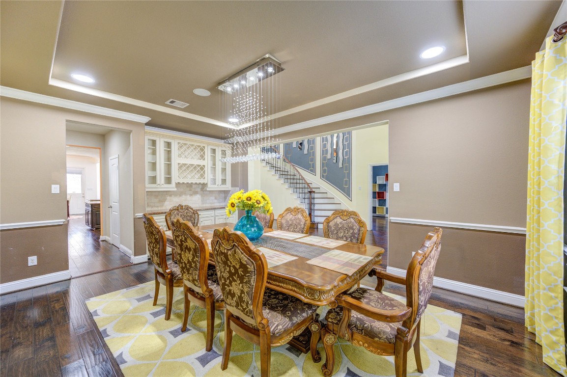3806 Sims Pointe Court Fulshear, TX 77441 - Photo 5 of 50 a view of a dining room with furniture and a table
