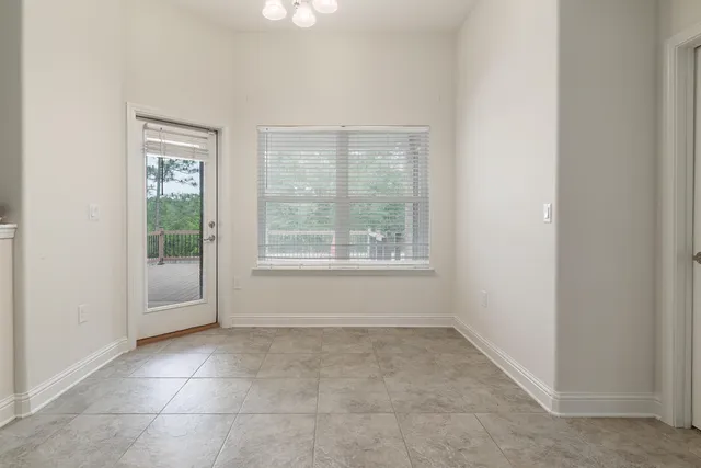 a bedroom with a bed and a ceiling fan