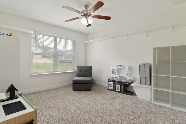 a living room with furniture and flat screen tv