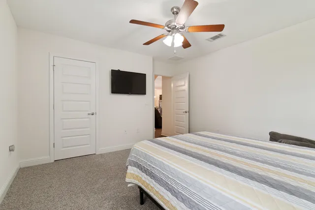 a view of a house with wooden floor and fence