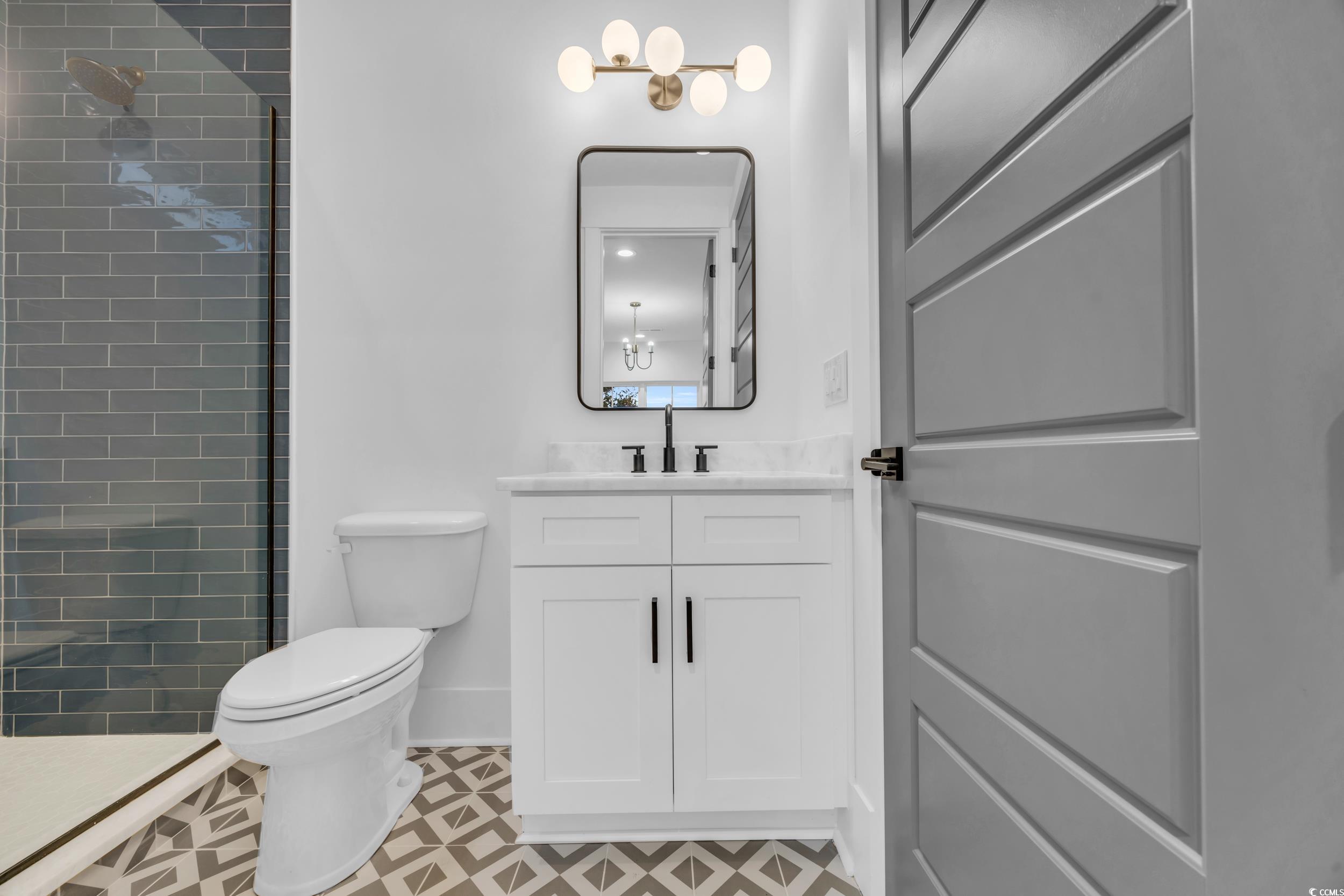 6703 Ocean Breeze Loop Myrtle Beach, SC 29572 - Photo 11 of 40 Bathroom featuring tile patterned floors, toilet,