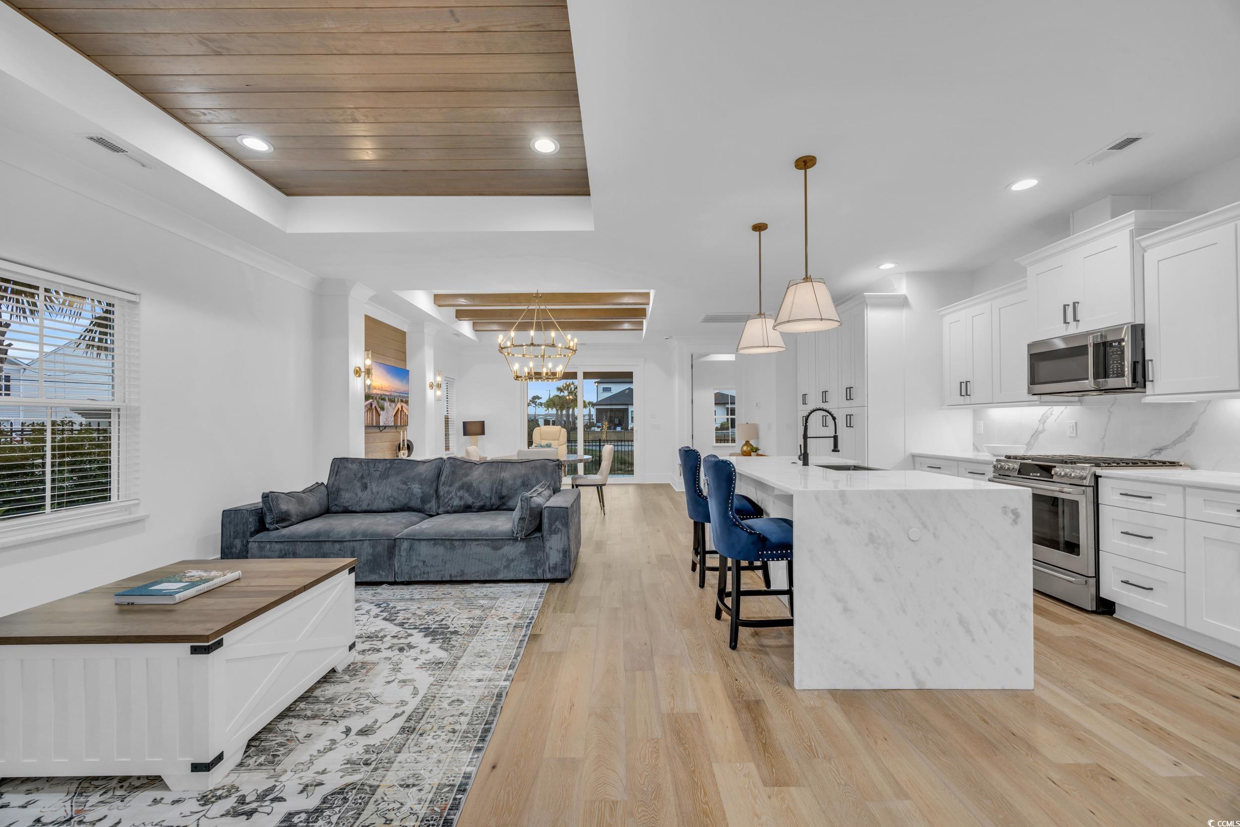 6703 Ocean Breeze Loop Myrtle Beach, SC 29572 - Photo 13 of 40 Kitchen featuring a center island with sink, white