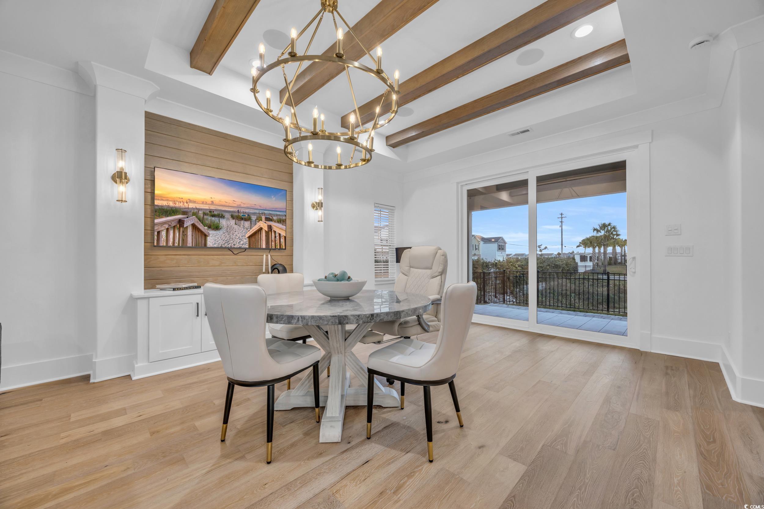 6703 Ocean Breeze Loop Myrtle Beach, SC 29572 - Photo 15 of 40 Dining area with a notable chandelier, beam ceilin