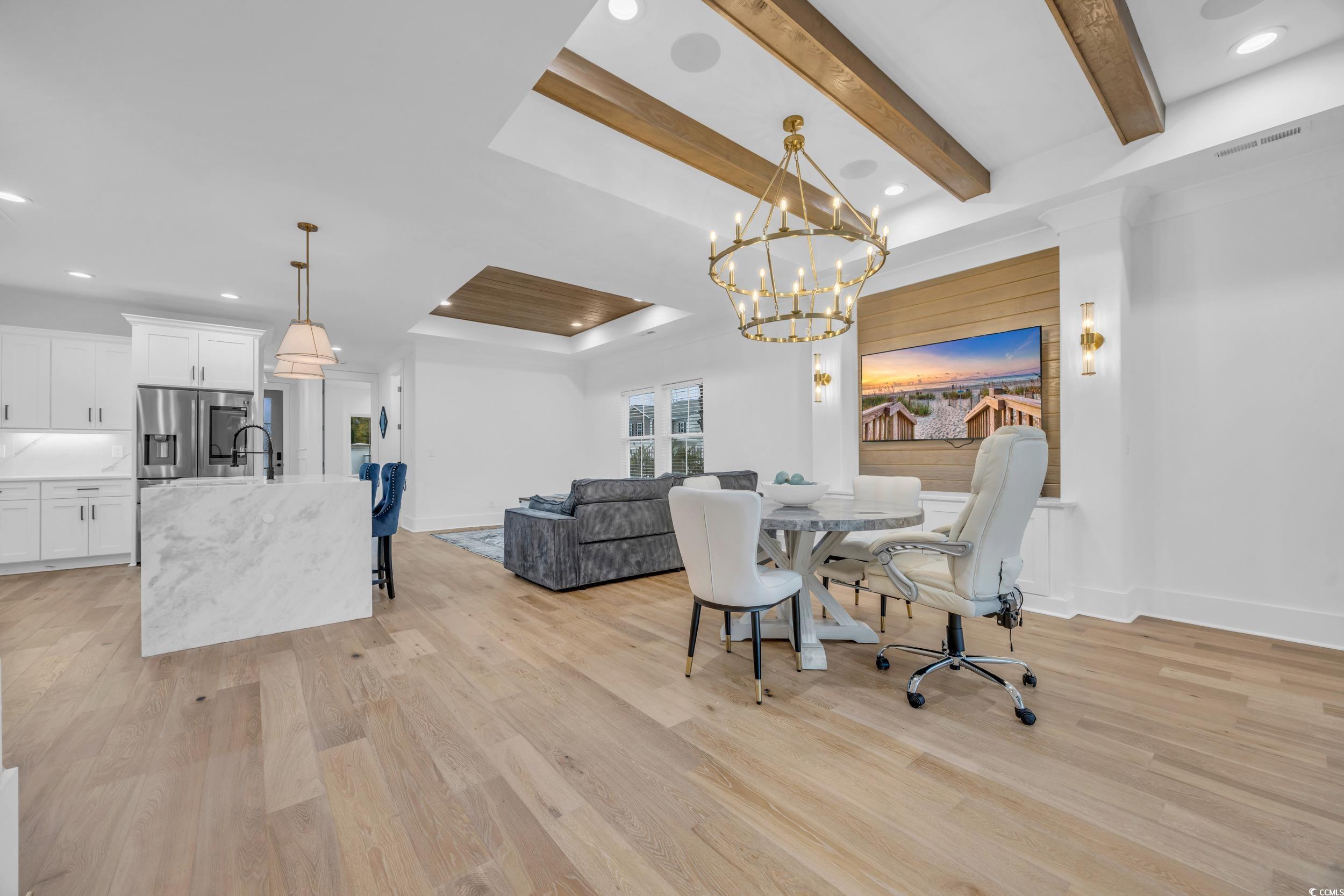 6703 Ocean Breeze Loop Myrtle Beach, SC 29572 - Photo 16 of 40 Dining area featuring beam ceiling, an inviting ch