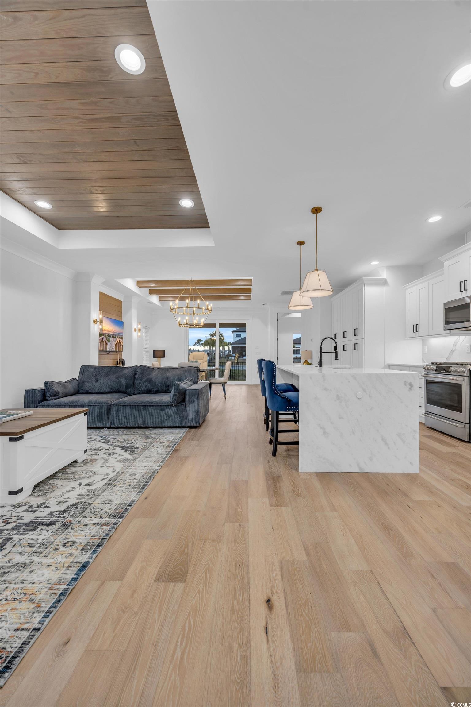6703 Ocean Breeze Loop Myrtle Beach, SC 29572 - Photo 23 of 40 Living room featuring wood ceiling, a raised ceili
