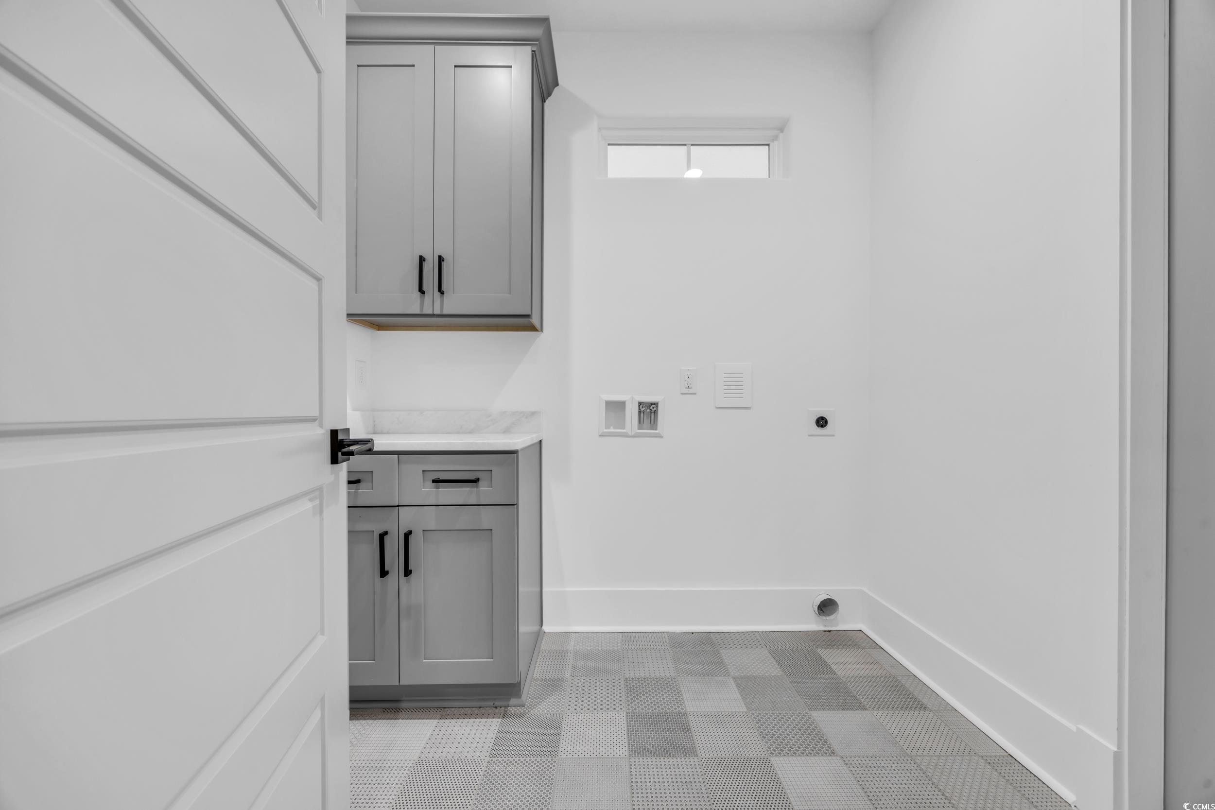 6703 Ocean Breeze Loop Myrtle Beach, SC 29572 - Photo 25 of 40 Laundry area featuring cabinets, hookup for a wash