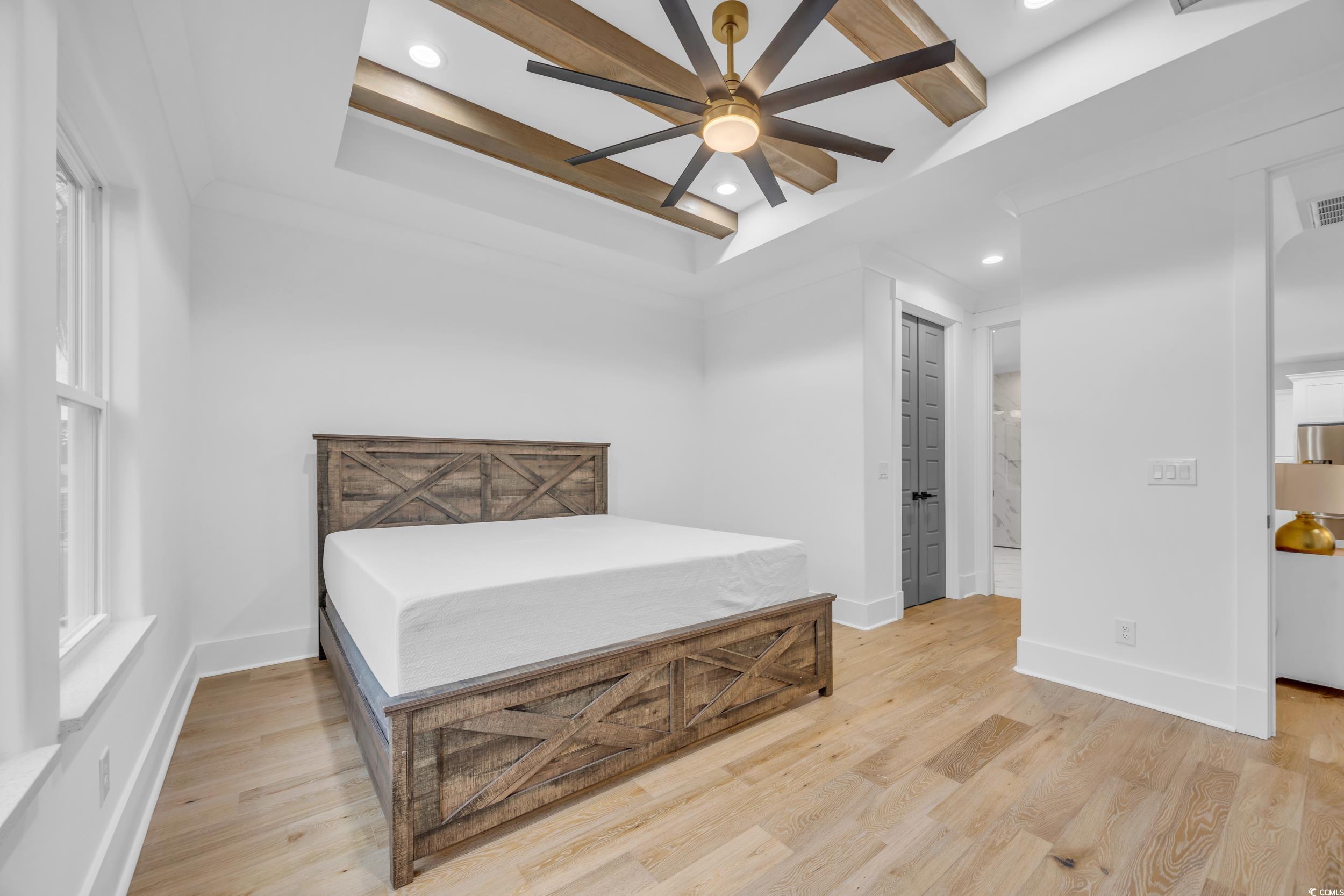 6703 Ocean Breeze Loop Myrtle Beach, SC 29572 - Photo 27 of 40 Bedroom featuring light wood-type flooring, a tray