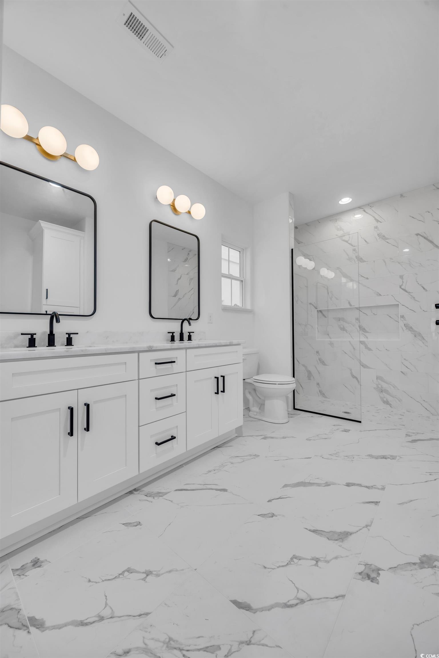 6703 Ocean Breeze Loop Myrtle Beach, SC 29572 - Photo 31 of 40 Bathroom with a shower, vanity, and toilet