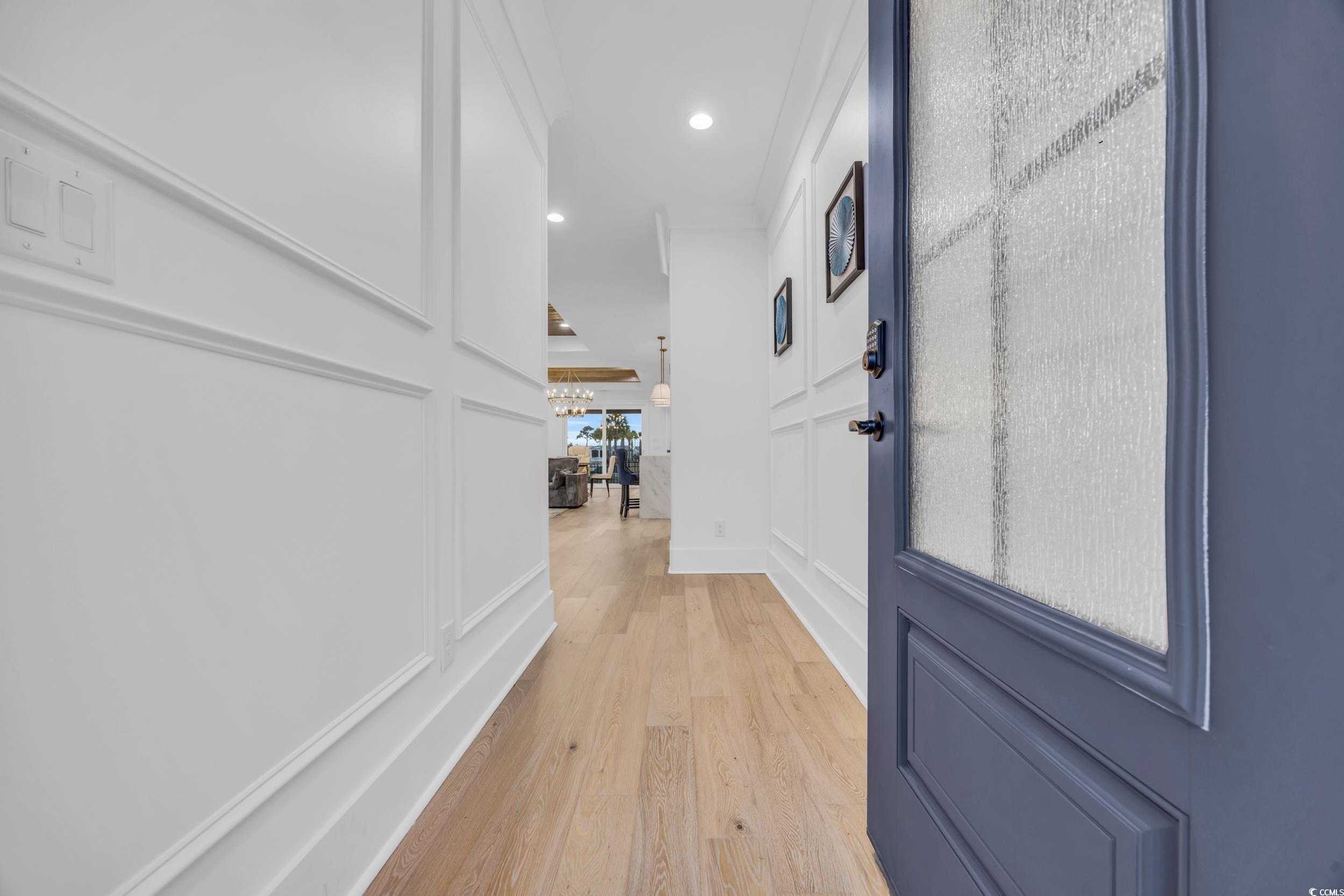 6703 Ocean Breeze Loop Myrtle Beach, SC 29572 - Photo 7 of 40 Hall with light hardwood / wood-style floors and o