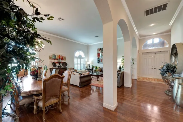 a view of a dining room with furniture window and wooden floor