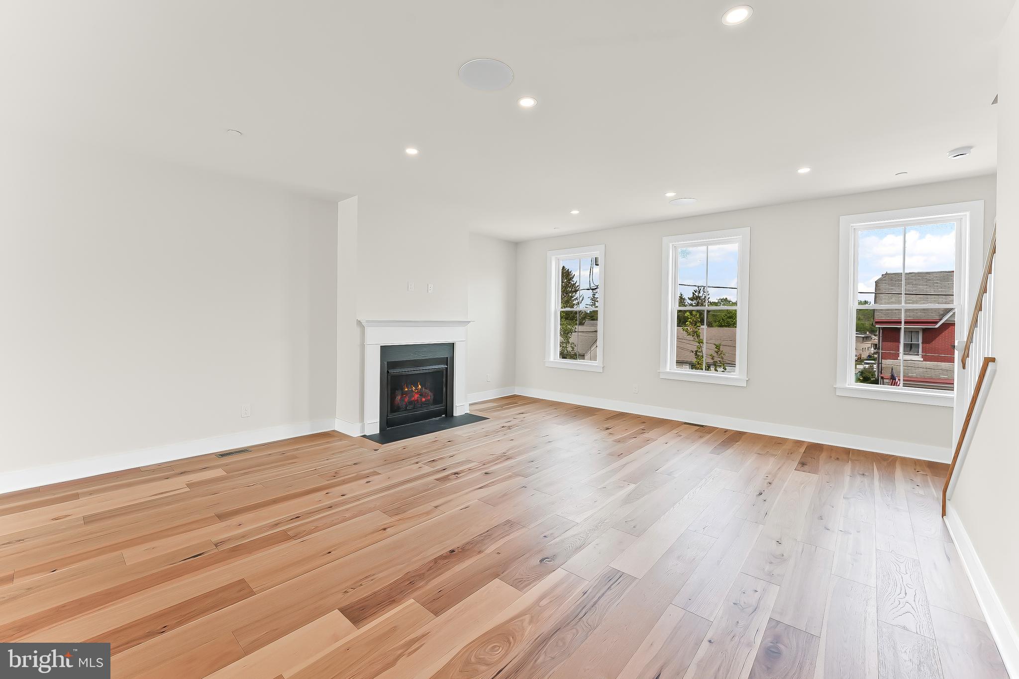 734 South Matlack Street West Chester, PA 19382 - Photo 12 of 22 a view of an empty room with wooden floor and a window