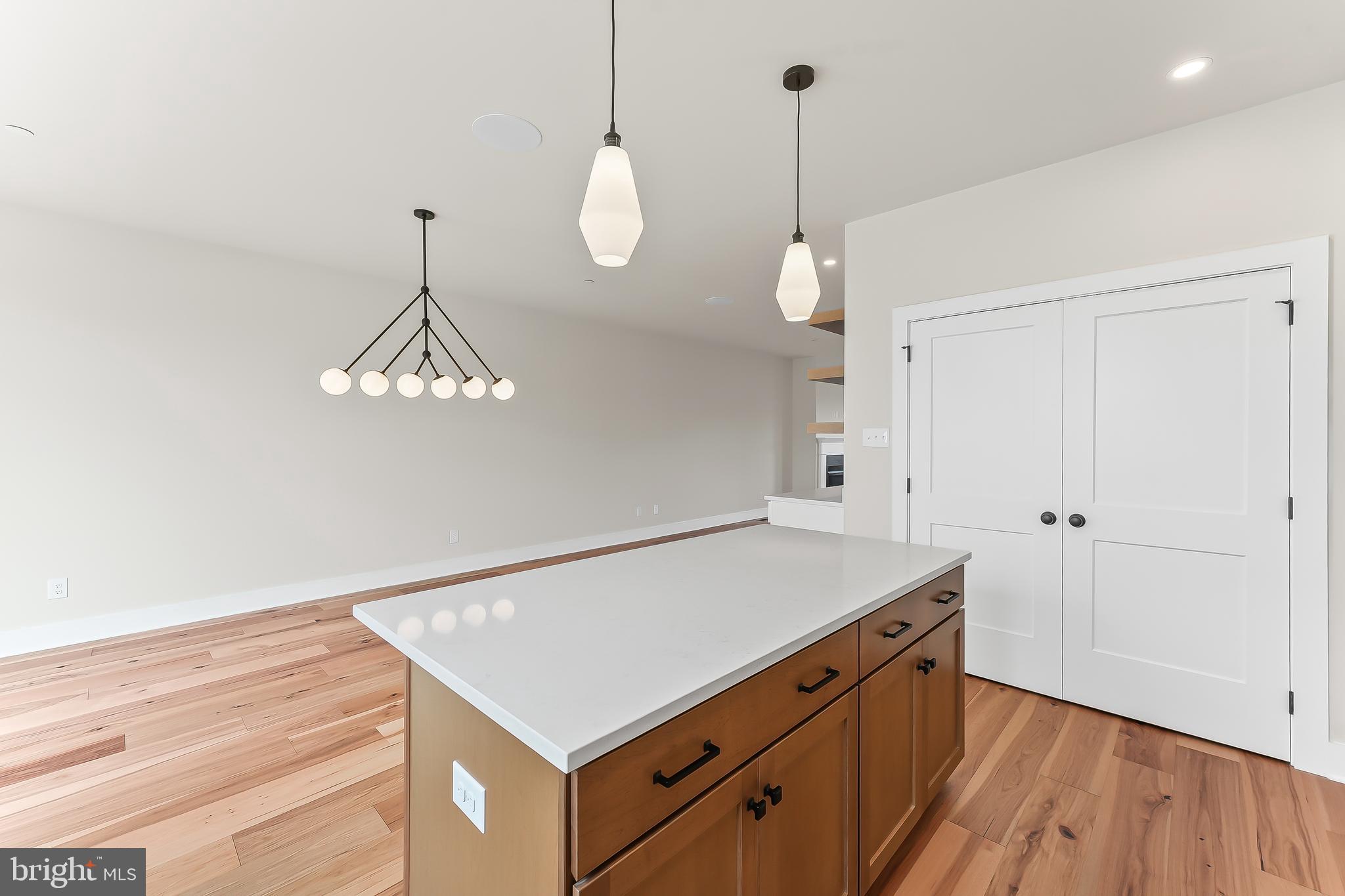 734 South Matlack Street West Chester, PA 19382 - Photo 13 of 22 a kitchen with a table chairs and wooden floor