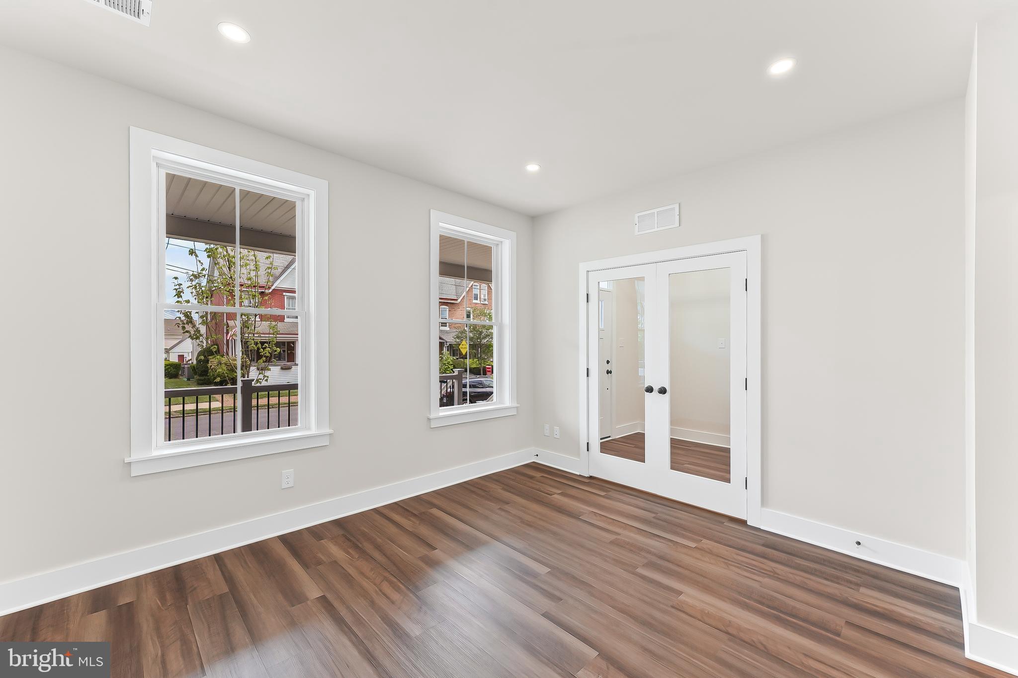 734 South Matlack Street West Chester, PA 19382 - Photo 16 of 22 an empty room with wooden floor and windows