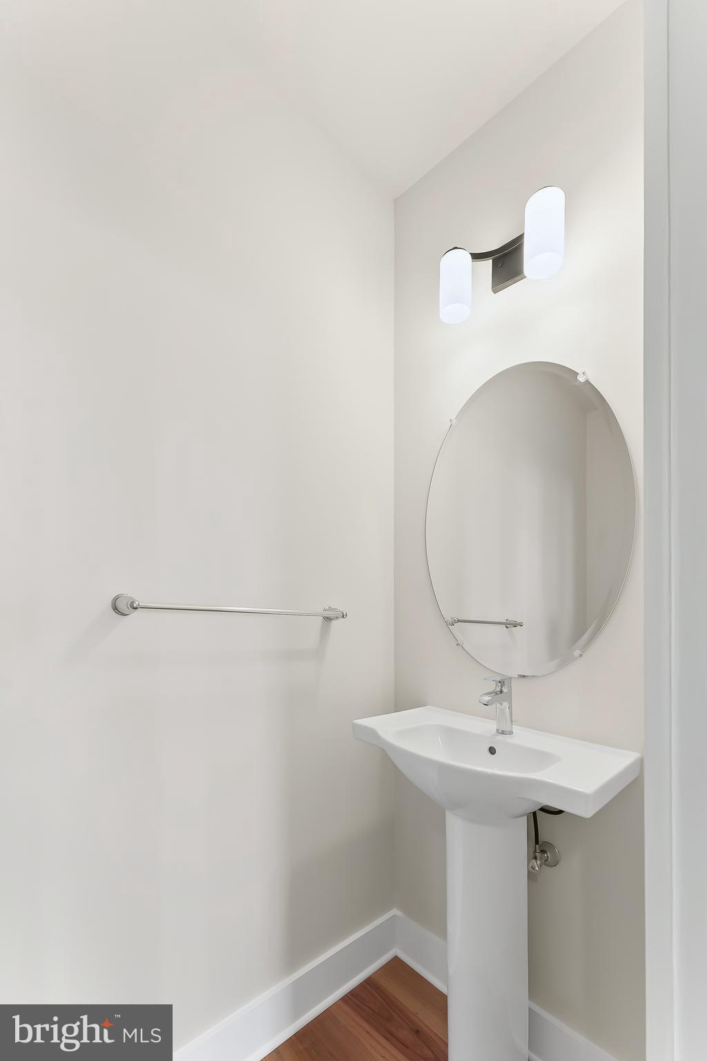 734 South Matlack Street West Chester, PA 19382 - Photo 18 of 22 a bathroom with a sink a mirror and vanity