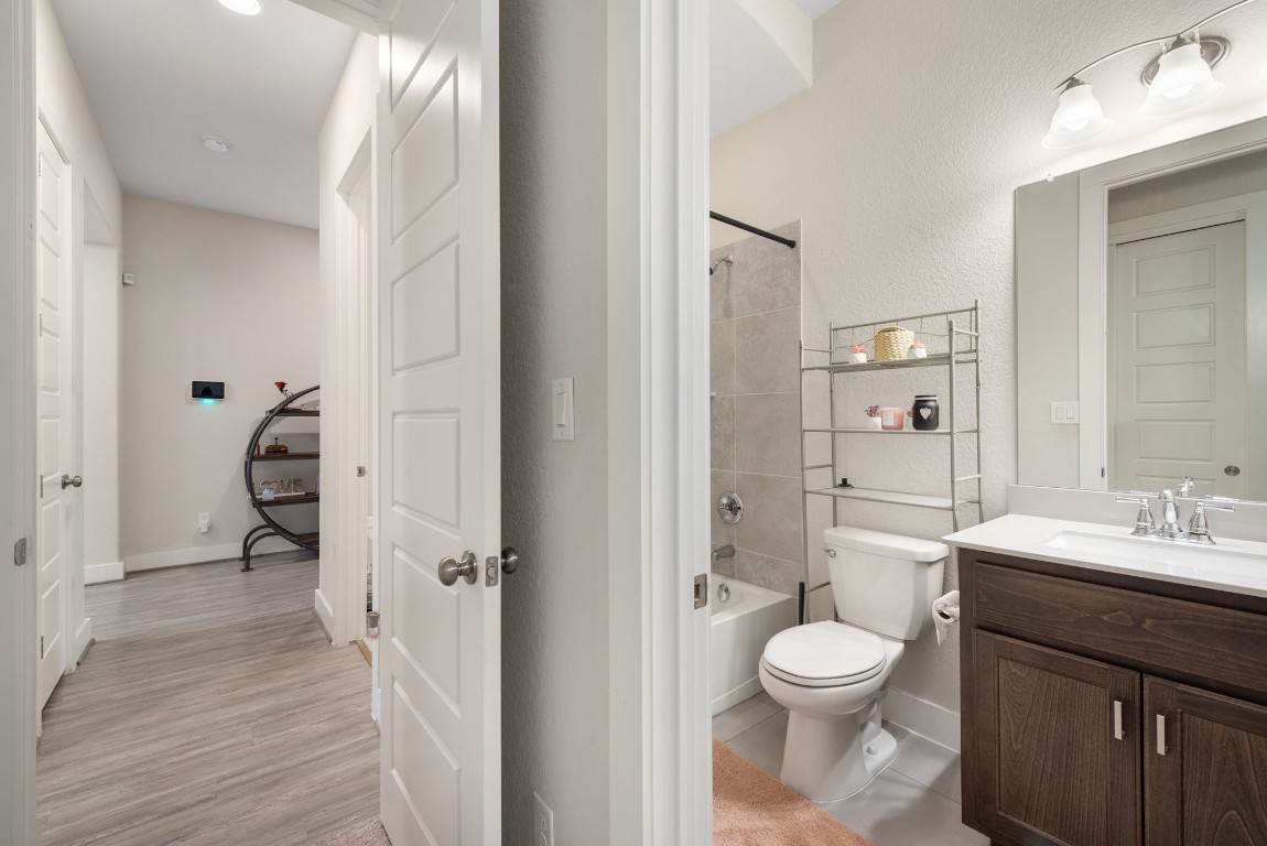 216 Emerald Garden Road San Marcos, TX 78666 - Photo 28 of 38 Bathroom with vanity and bathing tub / shower combination