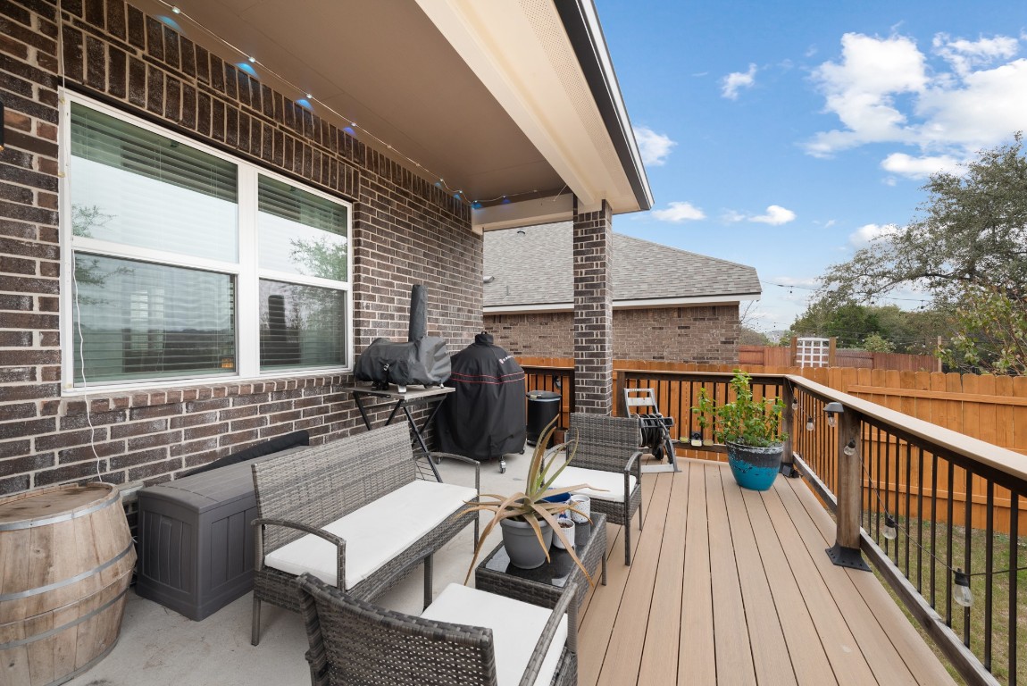 216 Emerald Garden Road San Marcos, TX 78666 - Photo 34 of 38 Wooden terrace with area for grilling and an outdoor living space