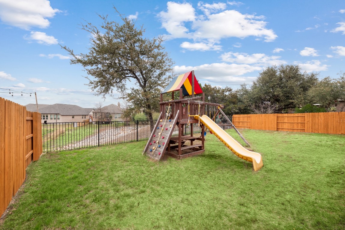 216 Emerald Garden Road San Marcos, TX 78666 - Photo 36 of 38 View of play area featuring a fenced backyard