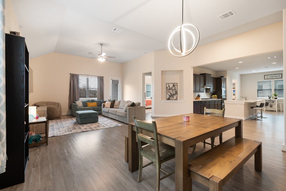 216 Emerald Garden Road San Marcos, TX 78666 - Photo 9 of 38 Dining area with wood finished floors, lofted ceiling, and a ceiling fan