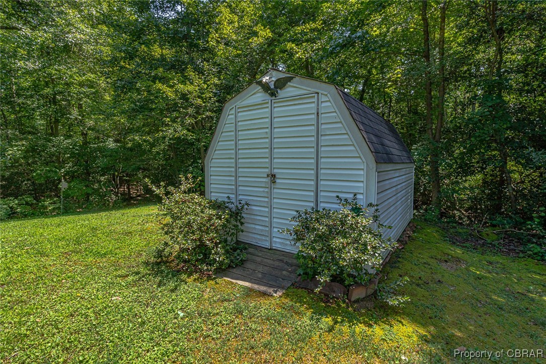 122 Old Glebe Point Road Burgess, VA 22432 - Photo 9 of 50 View of outbuilding with a yard