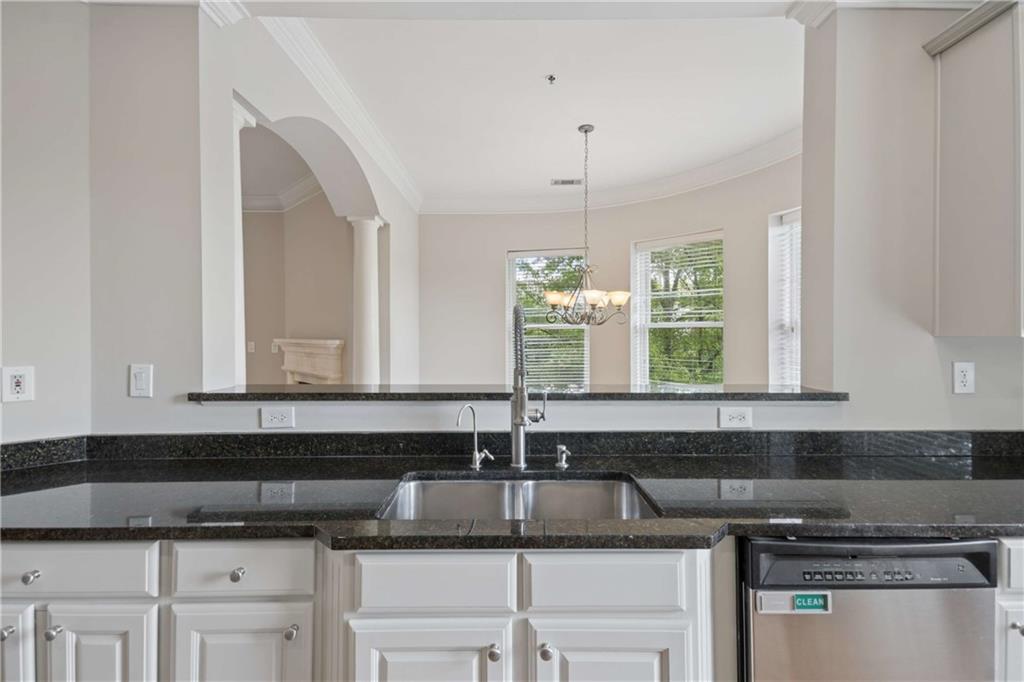 560 Dutch Valley Road Northeast, Unit 311 Atlanta, GA 30324 - Photo 17 of 44 a kitchen with a sink and cabinets
