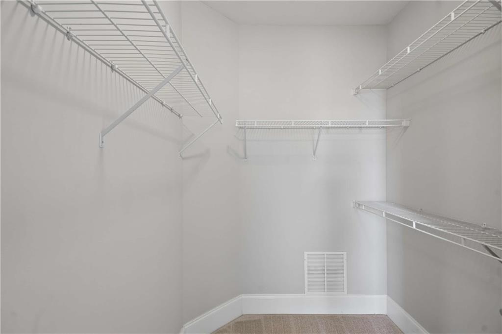560 Dutch Valley Road Northeast, Unit 311 Atlanta, GA 30324 - Photo 22 of 44 a view of small space with racks on the wall