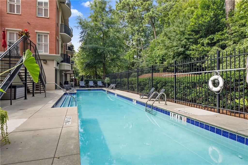 560 Dutch Valley Road Northeast, Unit 311 Atlanta, GA 30324 - Photo 34 of 44 a view of a backyard with sitting area