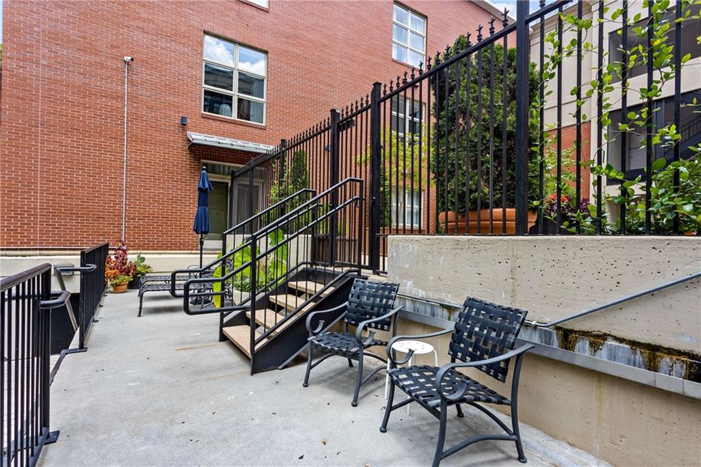 560 Dutch Valley Road Northeast, Unit 311 Atlanta, GA 30324 - Photo 41 of 44 a view of a chairs and table in the balcony