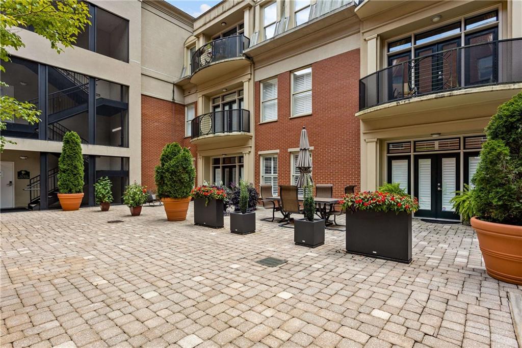 560 Dutch Valley Road Northeast, Unit 311 Atlanta, GA 30324 - Photo 42 of 44 a view of a house with outdoor space