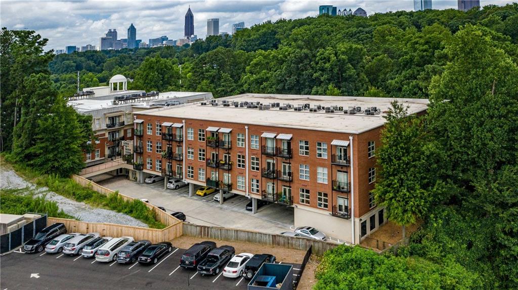 560 Dutch Valley Road Northeast, Unit 311 Atlanta, GA 30324 - Photo 43 of 44 an aerial view of a house with yard swimming pool and outdoor seating