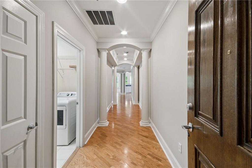 560 Dutch Valley Road Northeast, Unit 311 Atlanta, GA 30324 - Photo 6 of 44 a view of a hallway with wooden floor