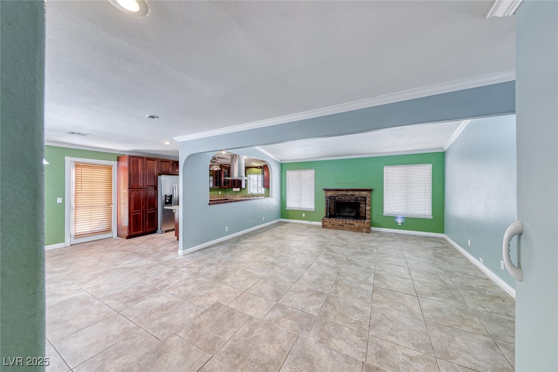 632 Arrayo Way Boulder City, NV 89005 - Photo 15 of 40 Unfurnished living room with ornamental molding, a