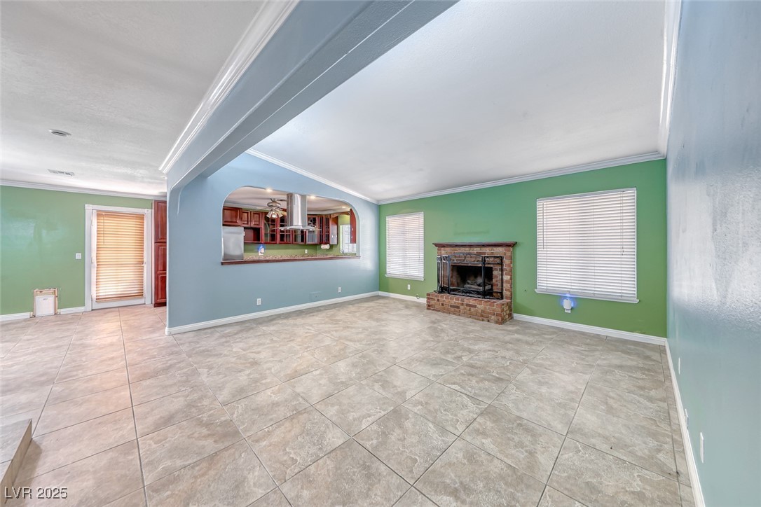 632 Arrayo Way Boulder City, NV 89005 - Photo 19 of 40 Unfurnished living room featuring crown molding, t