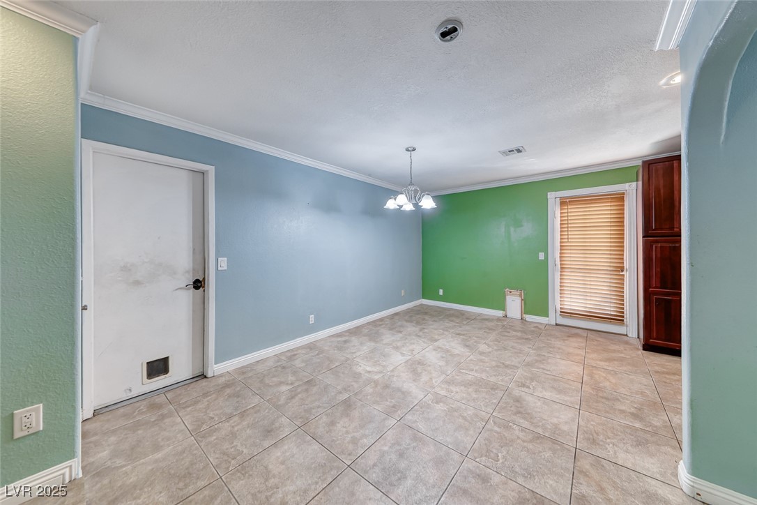 632 Arrayo Way Boulder City, NV 89005 - Photo 20 of 40 Unfurnished room featuring a chandelier, light til