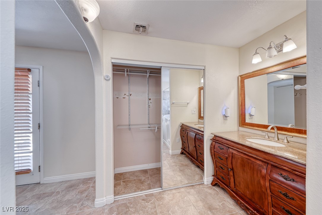 632 Arrayo Way Boulder City, NV 89005 - Photo 27 of 40 Bathroom featuring two vanities and baseboards