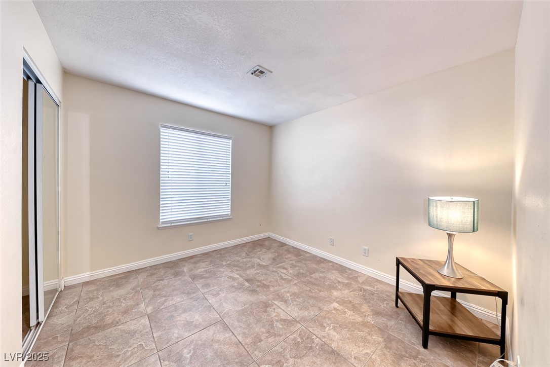 632 Arrayo Way Boulder City, NV 89005 - Photo 30 of 40 Unfurnished bedroom with baseboards, a closet, and
