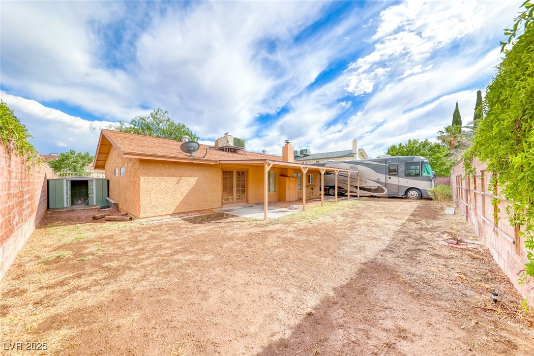 632 Arrayo Way Boulder City, NV 89005 - Photo 39 of 40 Rear view of house with a fenced backyard, stucco