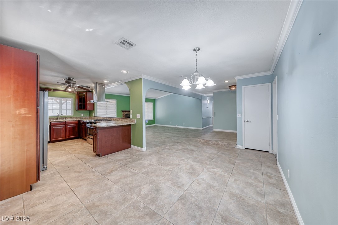 632 Arrayo Way Boulder City, NV 89005 - Photo 9 of 40 Kitchen with ornamental molding, island range hood