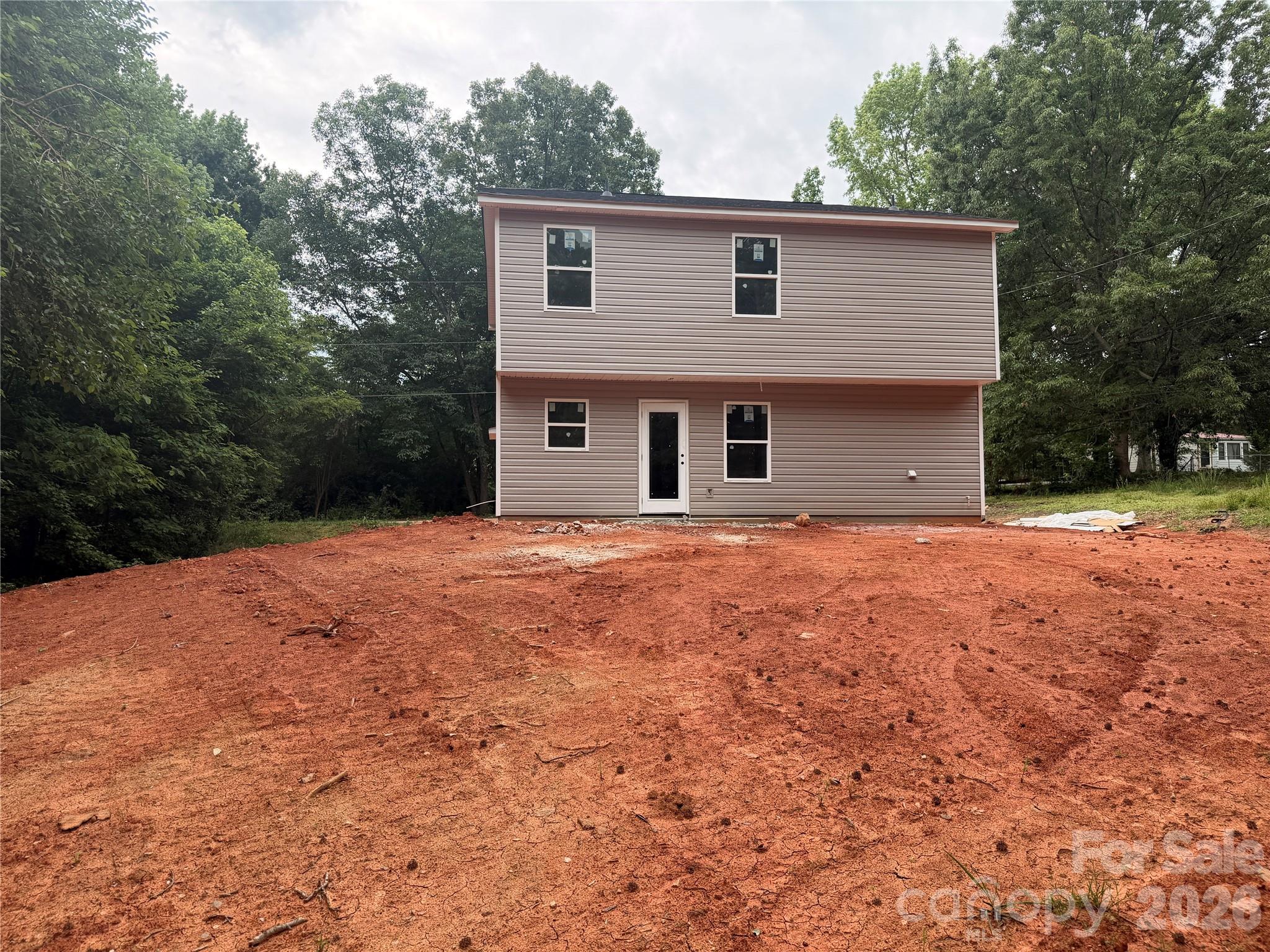2315 State Rd S-29-395 Lancaster, SC 29720 - Photo 19 of 21 a front view of house with yard and trees