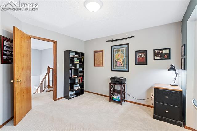 7510 Julynn Road Colorado Springs, CO 80919 - Photo 19 of 36 Upstairs bedroom 1 has a bay window and views!