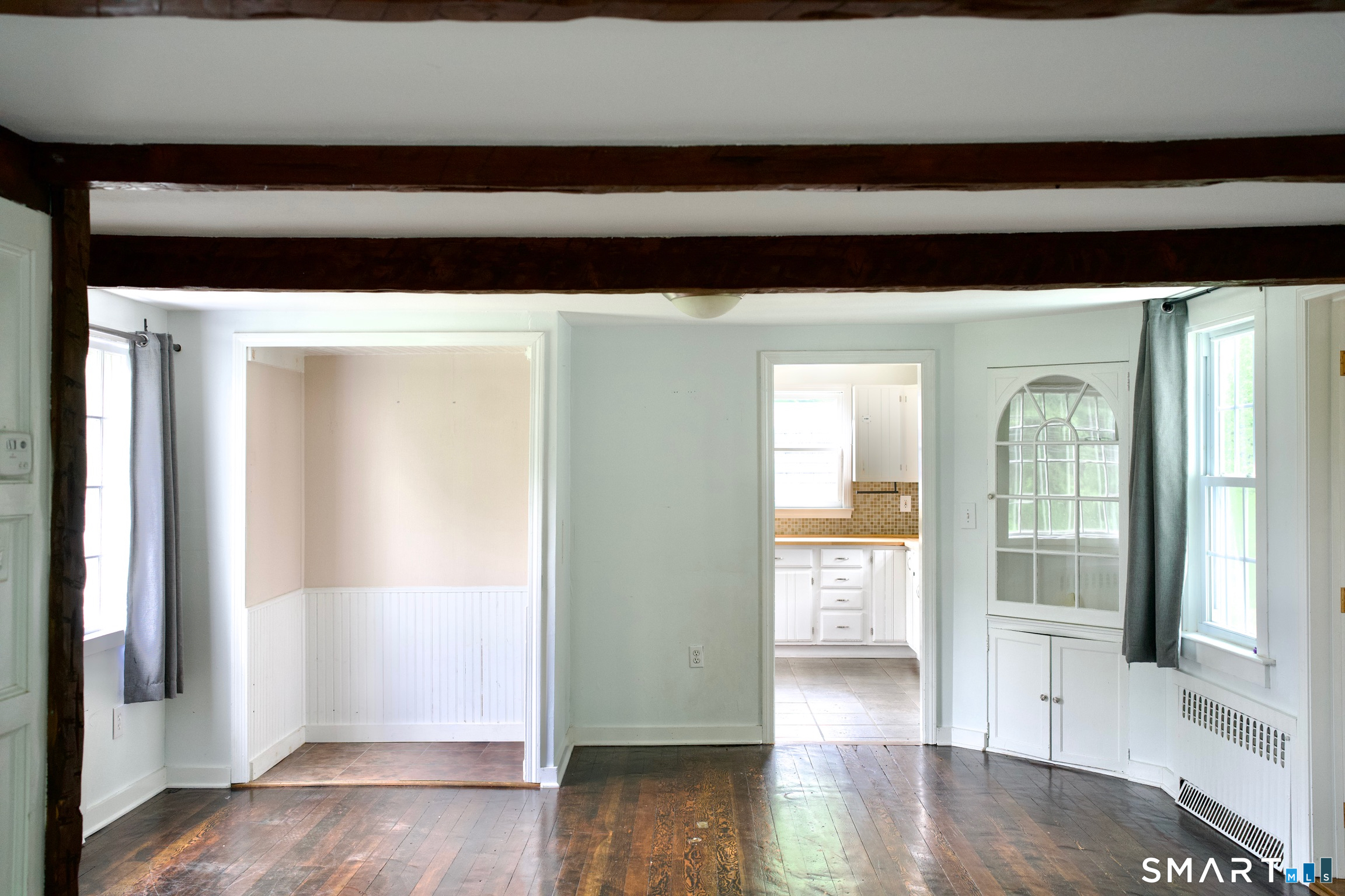 259 Peck Hill Road Woodbridge, CT 06525 - Photo 12 of 32 a view of a hallway with wooden floor and a cabinet