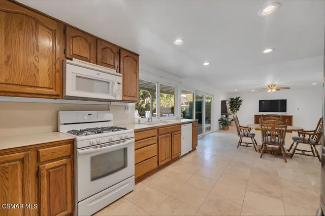 a kitchen with sink cabinets and stainless steel appliances