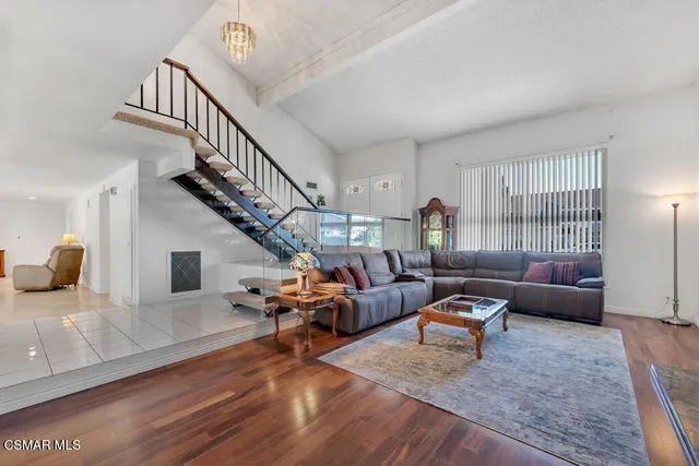 a living room with furniture or couch and a wooden floor