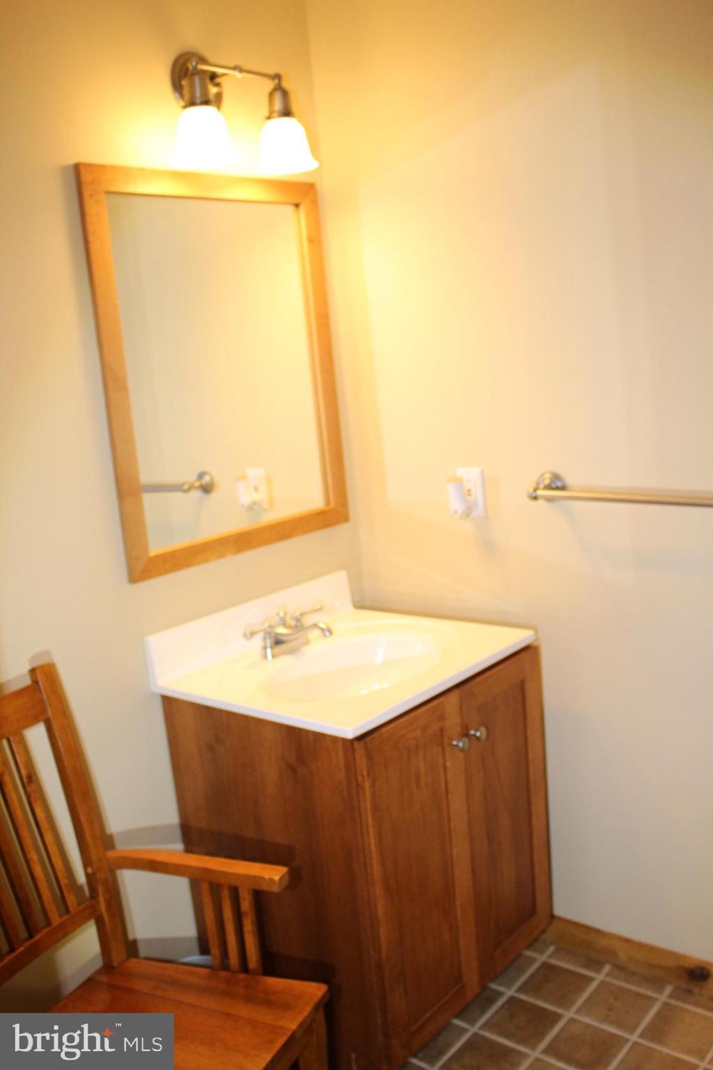 176 South Patricia Drive Swedesboro, NJ 08085 - Photo 11 of 61 a bathroom with a sink vanity and a mirror