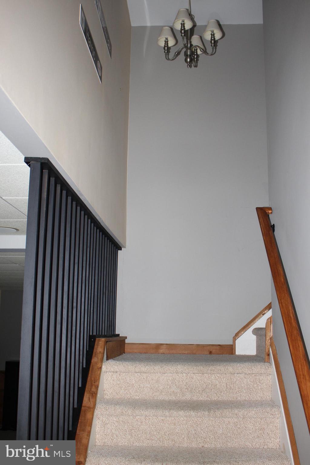 176 South Patricia Drive Swedesboro, NJ 08085 - Photo 15 of 61 a view of a hallway with stairs and a couch