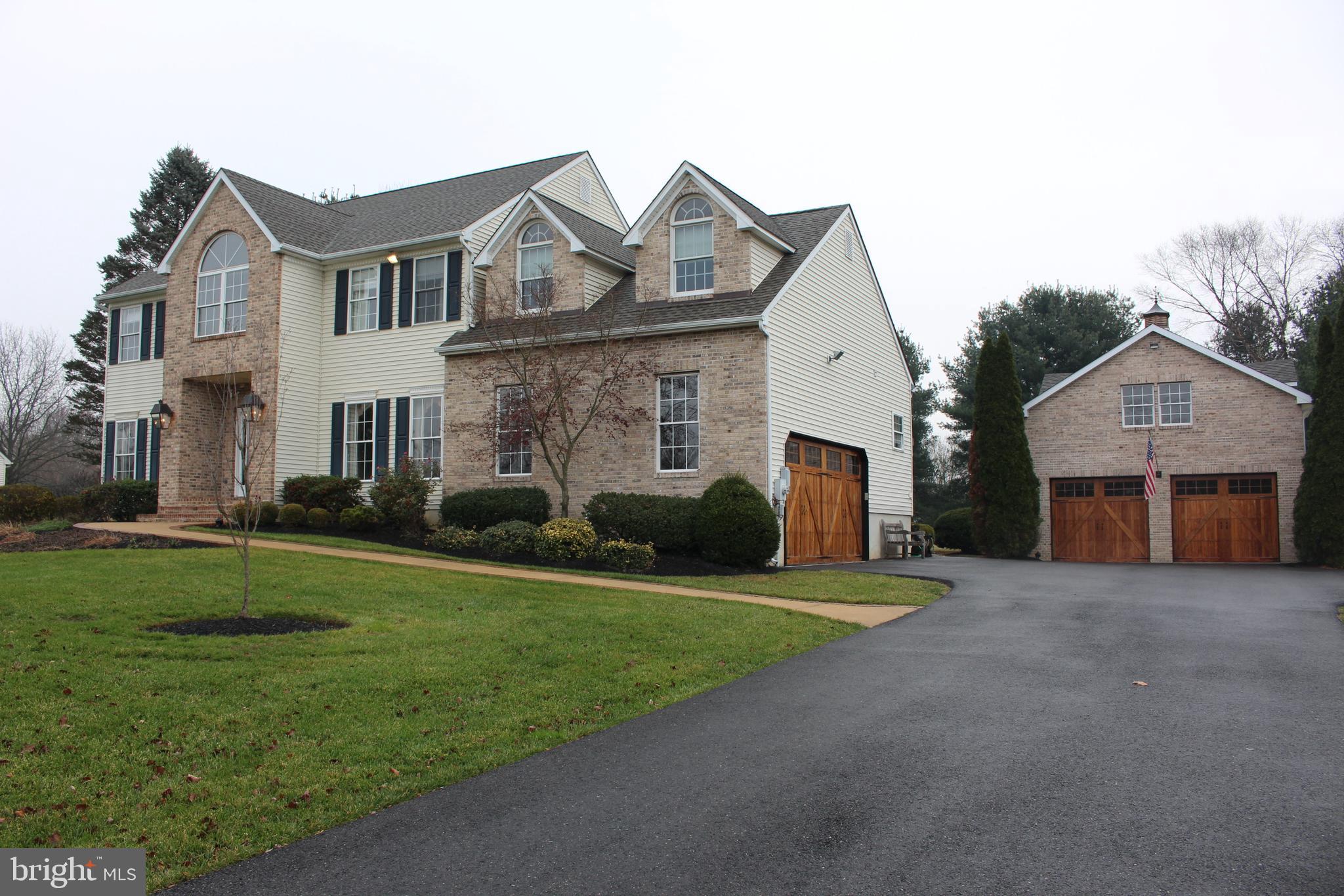 176 South Patricia Drive Swedesboro, NJ 08085 - Photo 21 of 61 a front view of a house with a yard and garage