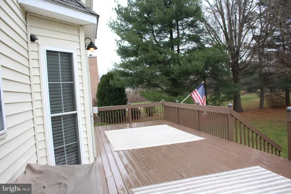 a kitchen with stainless steel appliances kitchen island granite countertop a refrigerator and microwave