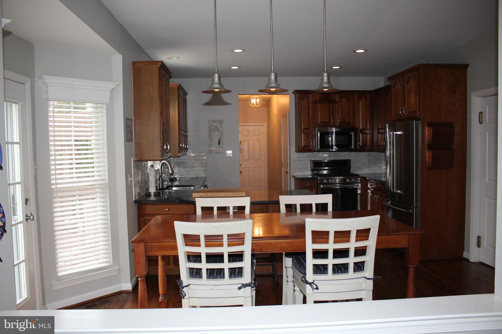 176 South Patricia Drive Swedesboro, NJ 08085 - Photo 34 of 61 a kitchen with stainless steel appliances kitchen island granite countertop a refrigerator and microwave