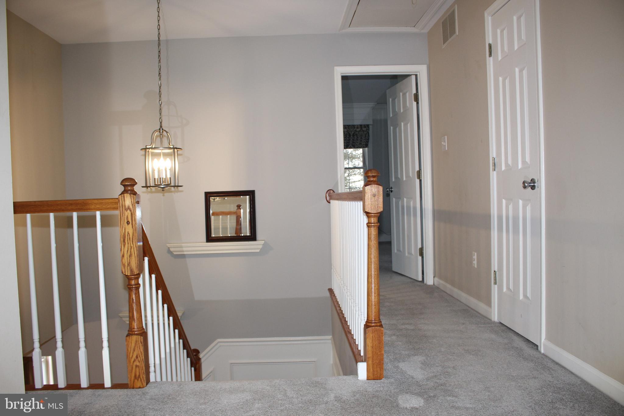 176 South Patricia Drive Swedesboro, NJ 08085 - Photo 42 of 61 a view of a hallway with entryway wooden floor and front door
