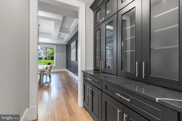 a view of a hallway view with wooden floor and staircase